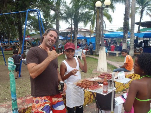 Brian Swan and street food seller at Bocas Del Toro Carnival